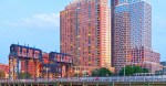 image of the long island city sign with modern hirise architecture in the background