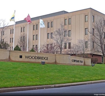 woodbridge corporate plaza front sign and flags flying in iselin new jersey
