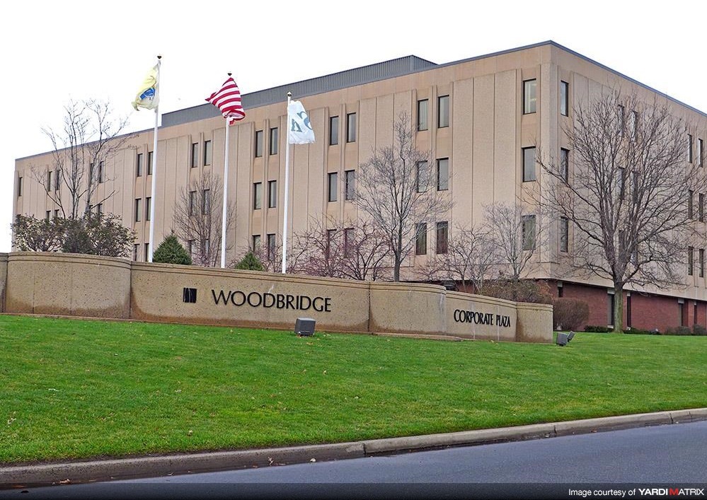 woodbridge corporate plaza front sign and flags flying in iselin new jersey