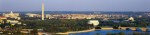 aerial view of Washington, DC. The Potomac River runs through the center with the Key Bridge at right at sunset.