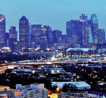 Apartment Construction 2017 - Dallas TX skyline at night Rent Cafe