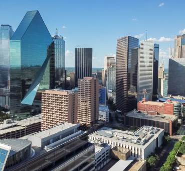 aerial view of uptown dallas office space buildings with facades gleaming in the sunlight