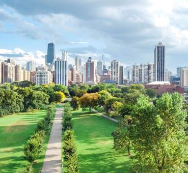 aerial panoramic view of chicago lakefront and central business district office towers as seen from above millennium park green space