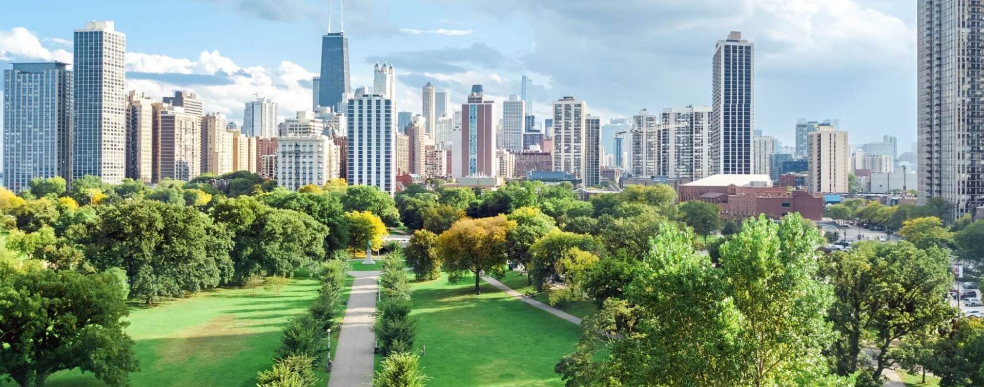 aerial panoramic view of chicago lakefront and central business district office towers as seen from above millennium park green space
