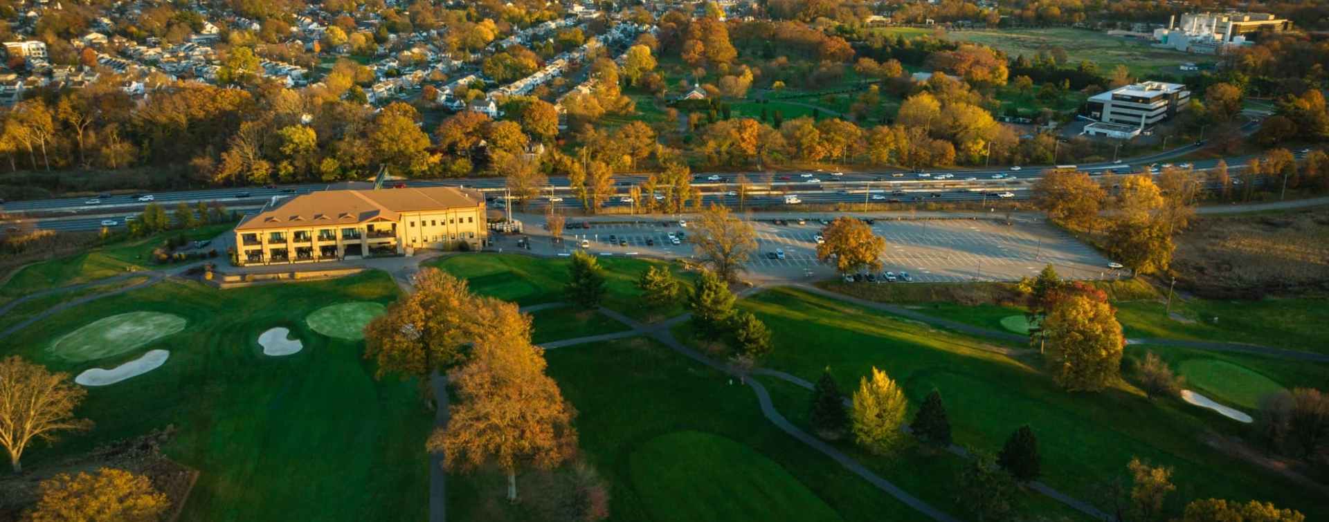 aerial panoramic view of the kenilworth new jersey golf course in the closer plane and the Northeast Science & Technology (NEST) Center (frmerly mercl campus) further back and to the right