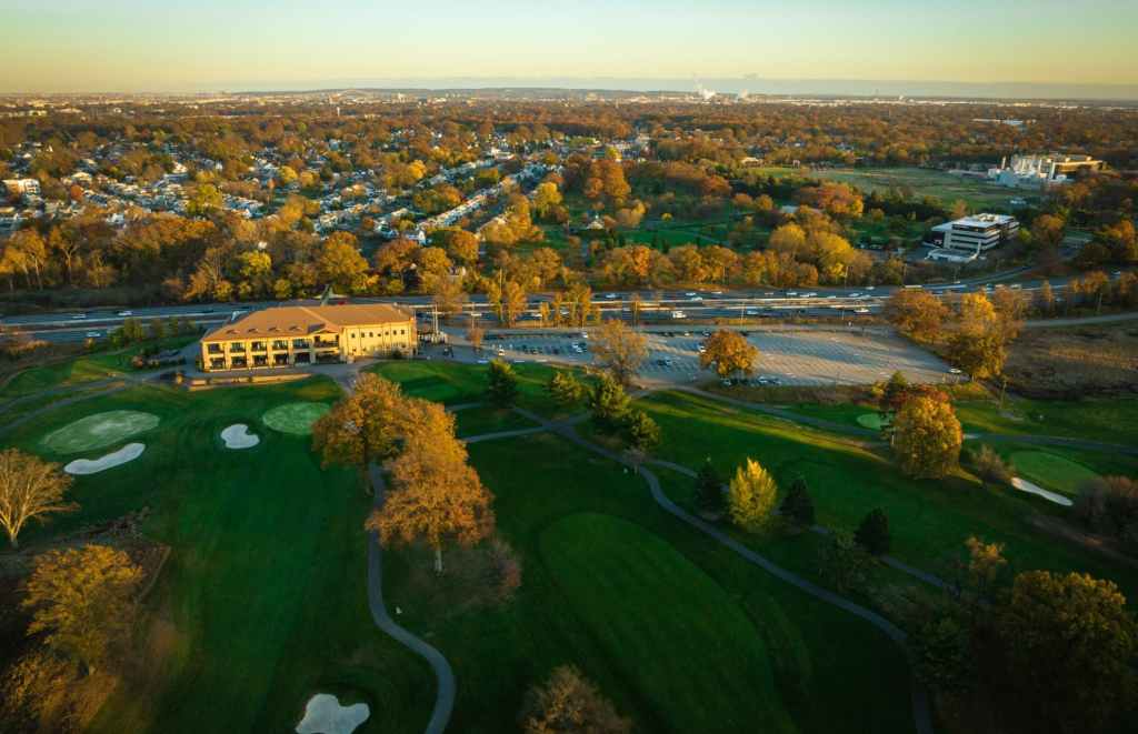 aerial panoramic view of the kenilworth new jersey golf course in the closer plane and the Northeast Science & Technology (NEST) Center (frmerly mercl campus) further back and to the right