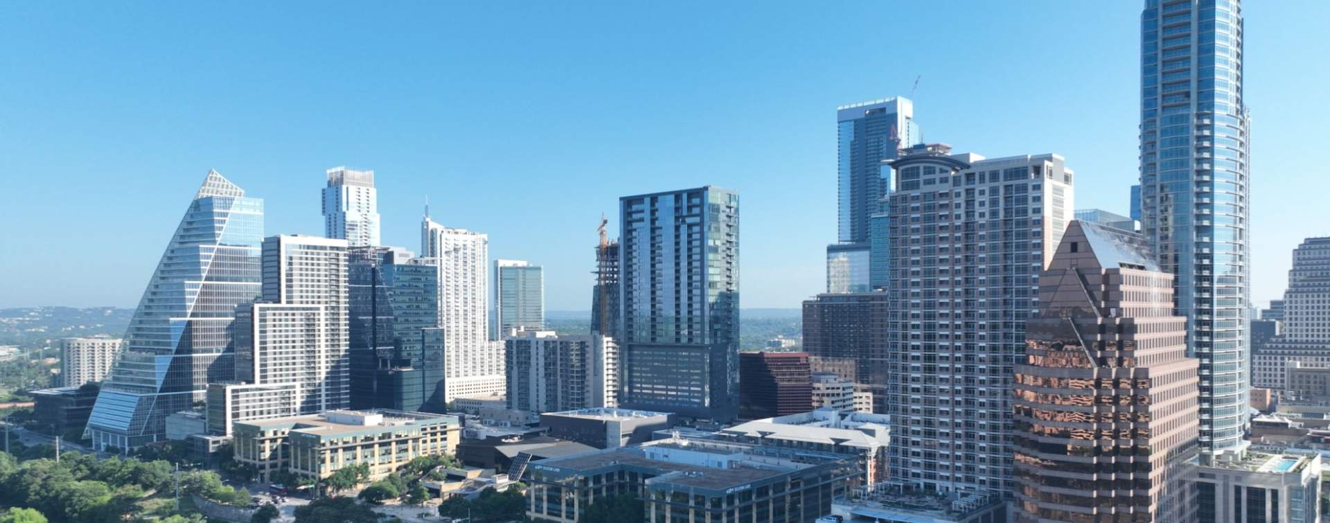 panoramic view of high-rises and skyscrapers in downtown Austin, Texas, on the north shore of the colorado river