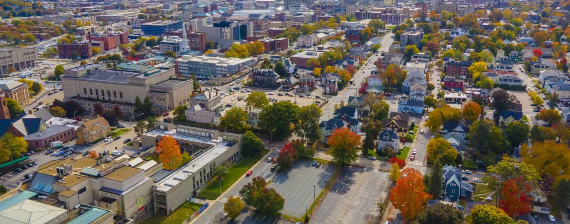 Worcester Massachusetts panoramic aerial view of the historic neighborhoods in the forefront and the central business district in the background