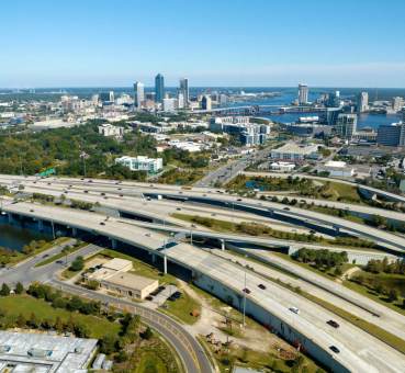 aerial panoramic view of highways heading into jacksonville florida, with the jacksonville skyline in the background