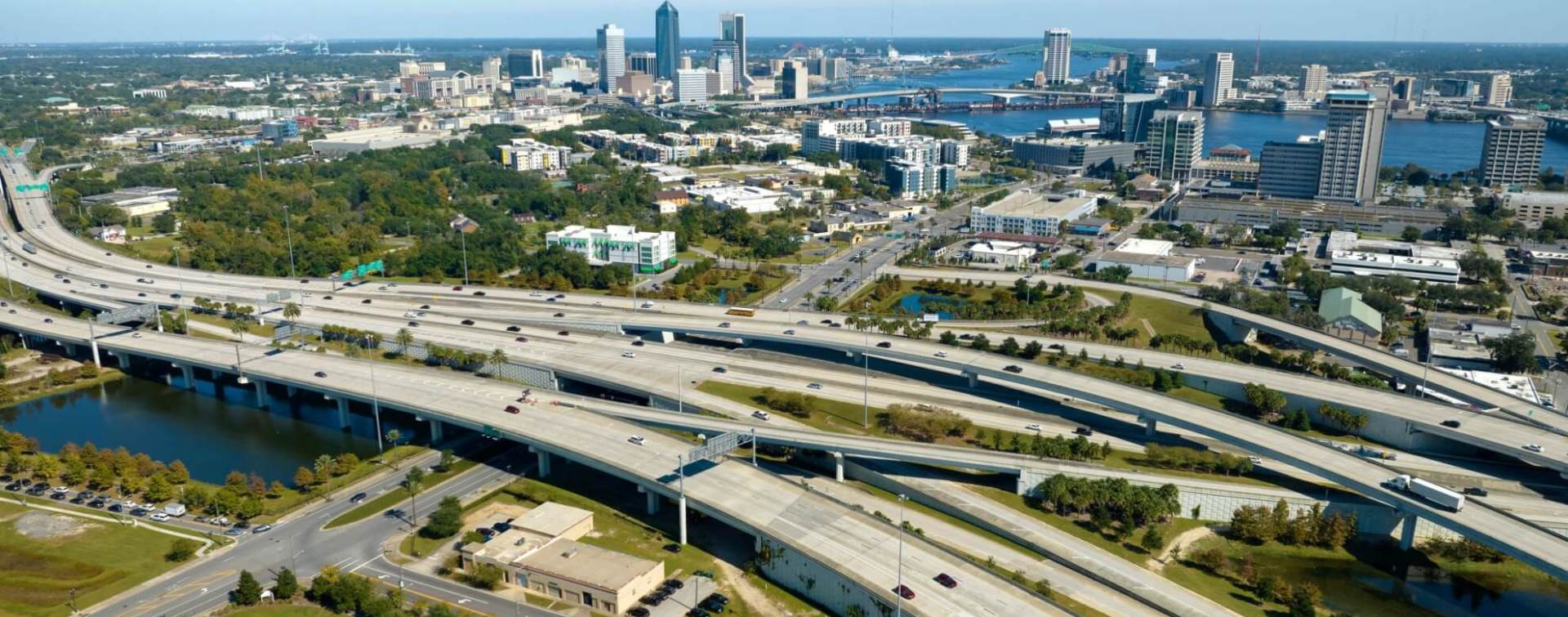 aerial panoramic view of highways heading into jacksonville florida, with the jacksonville skyline in the background