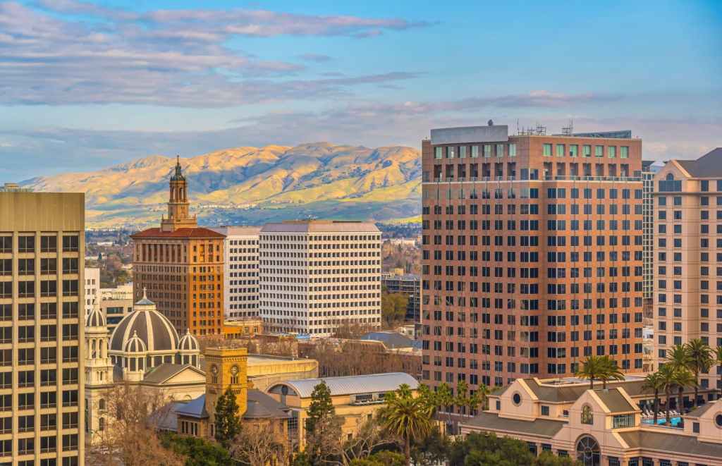 san diego central business district highrise skyline with mountains in the background