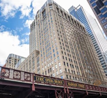chicago civic opera building and lyric opera bridge viewed from the chicago river