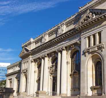 washington dc mt vernon square carnegie library forefront and 901 k street office building background