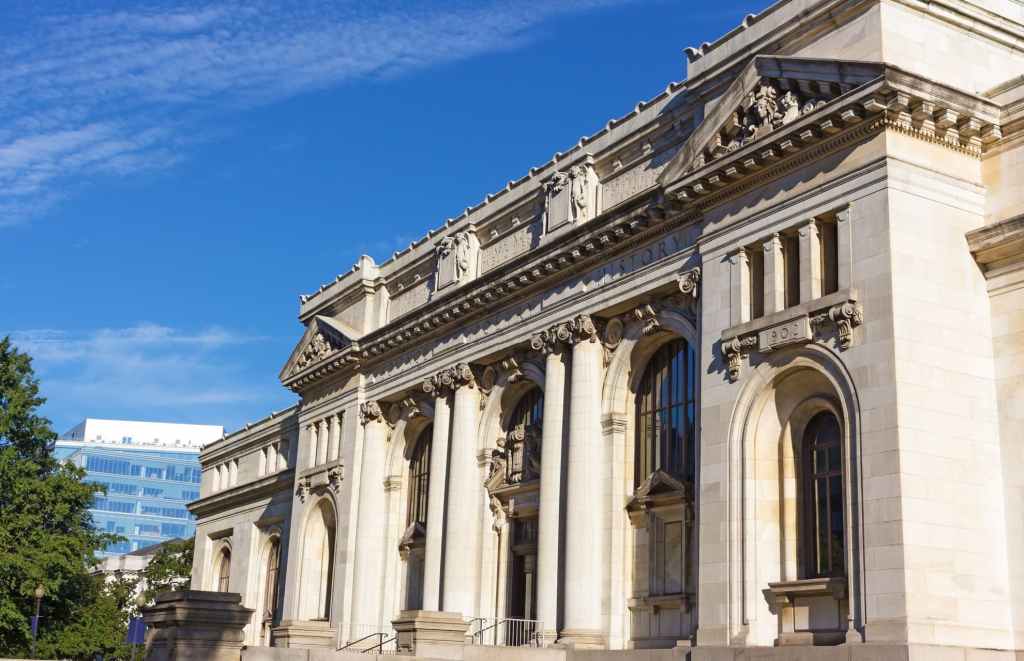 washington dc mt vernon square carnegie library forefront and 901 k street office building background