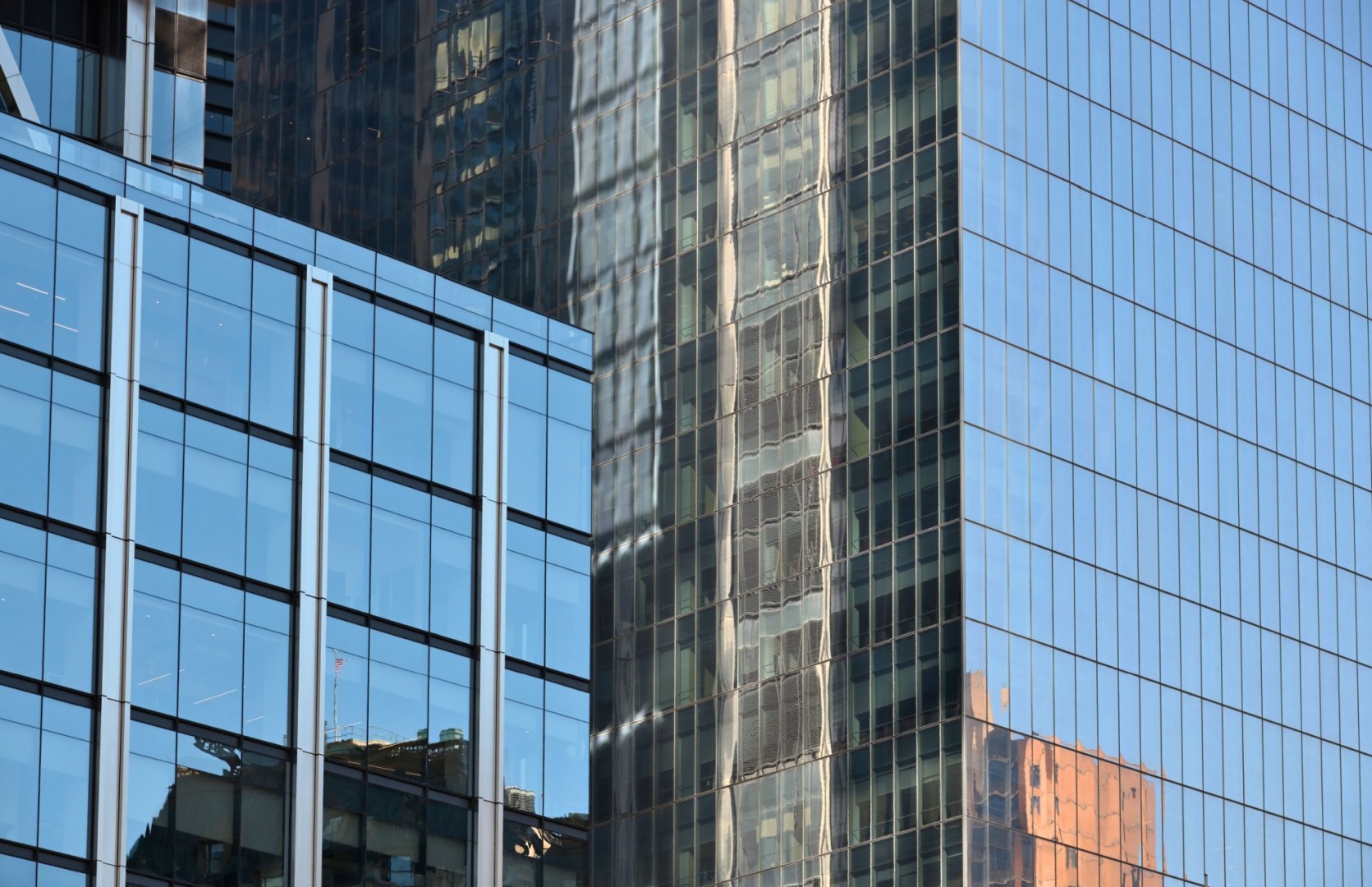 level view of glass facade of office skyscrapers