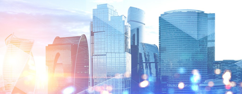 Panoramic view of modern cityscape with skyscrapers and glass towers with double exposure of triangular pattern for expert insights with joe killinger