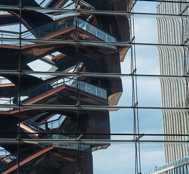 Image of the glass facade of one of the Hudson Yards buildings