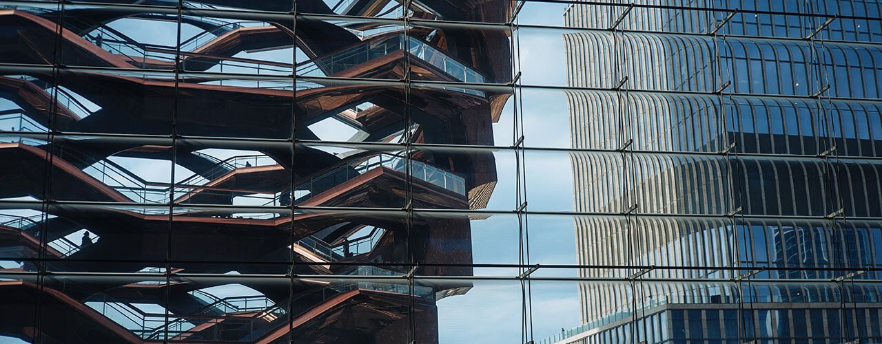 Image of the glass facade of one of the Hudson Yards buildings
