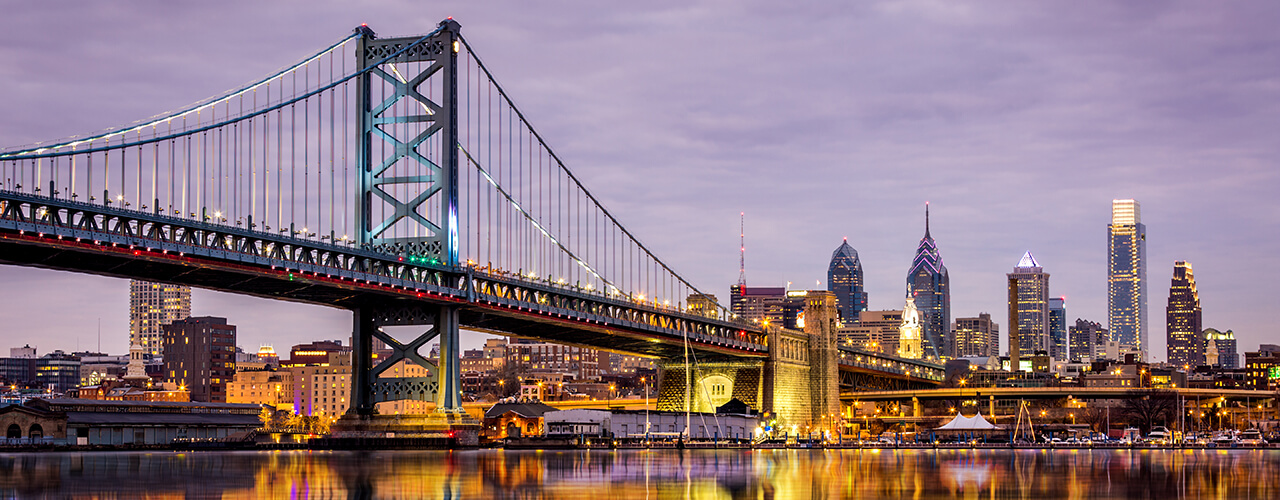 bridge stretching toward Philadelphia skyline