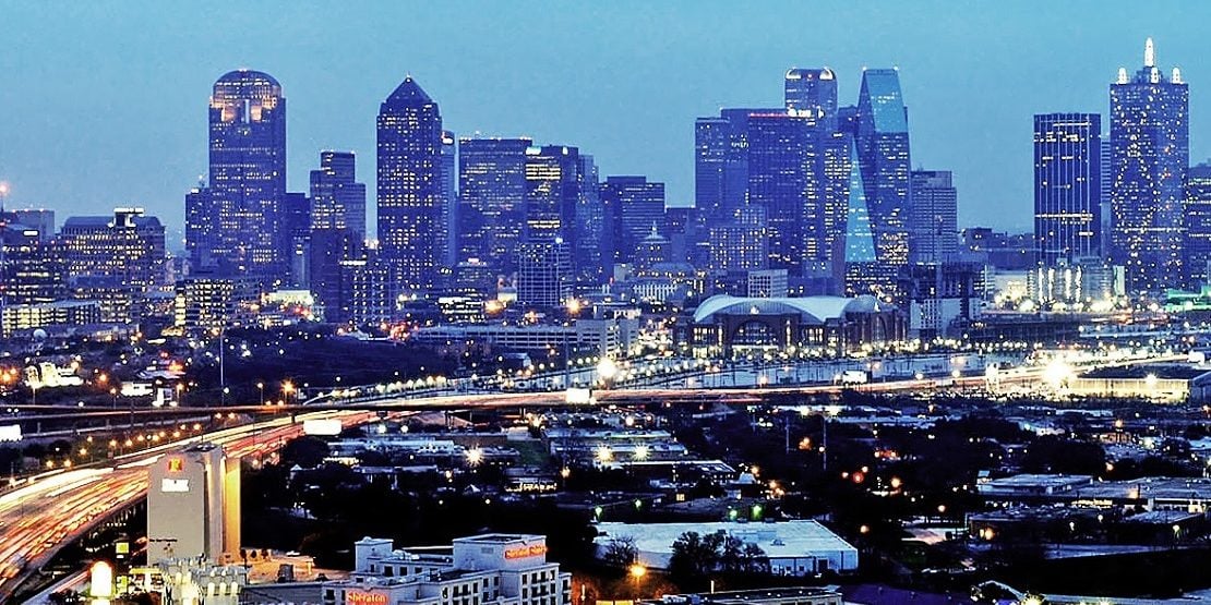 Apartment Construction 2017 - Dallas TX skyline at night Rent Cafe