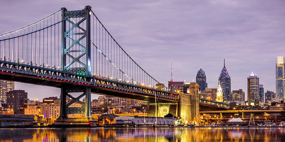 bridge stretching toward Philadelphia skyline