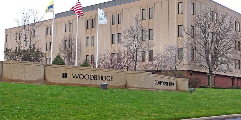 woodbridge corporate plaza front sign and flags flying in iselin new jersey