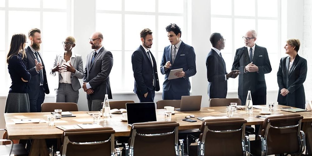 Image of a diverse group of business professionals collaborating at a meeting