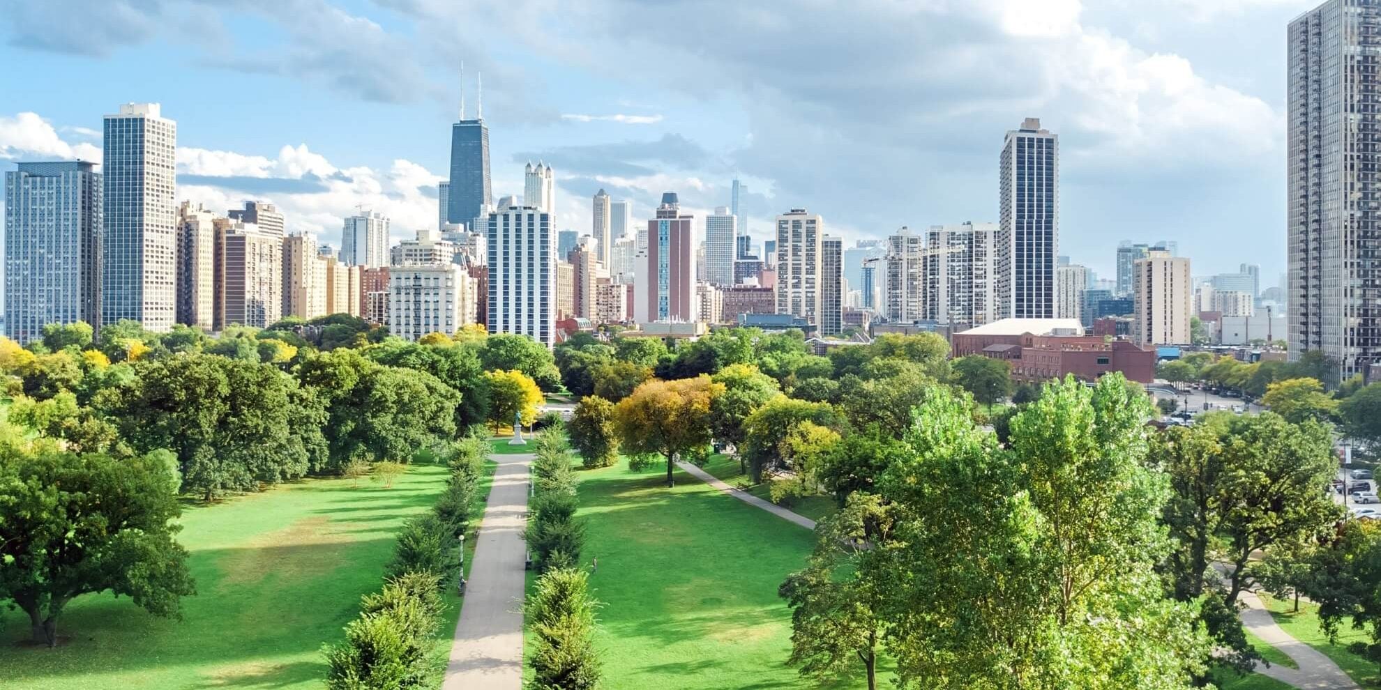 aerial panoramic view of chicago lakefront and central business district office towers as seen from above millennium park green space