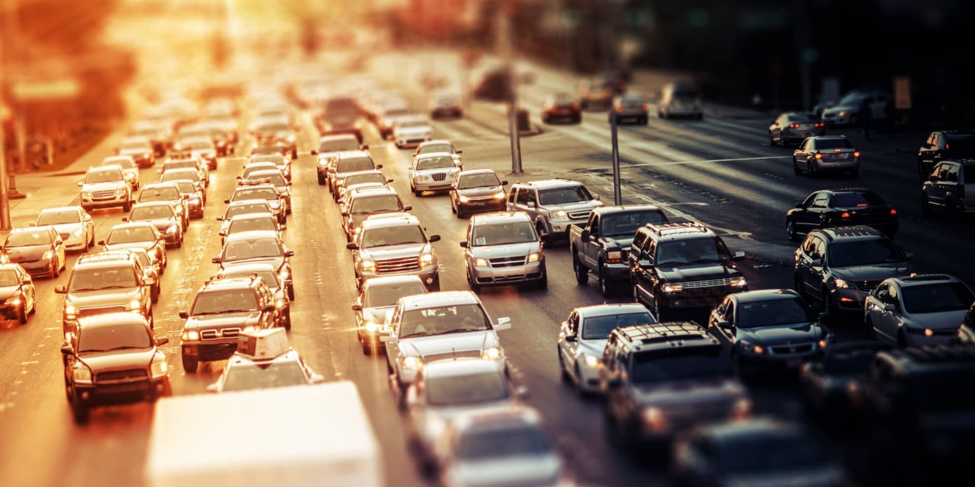 photo of busy 12-lane road at sunset used for an article about commute times in the largest cities of the southern us region