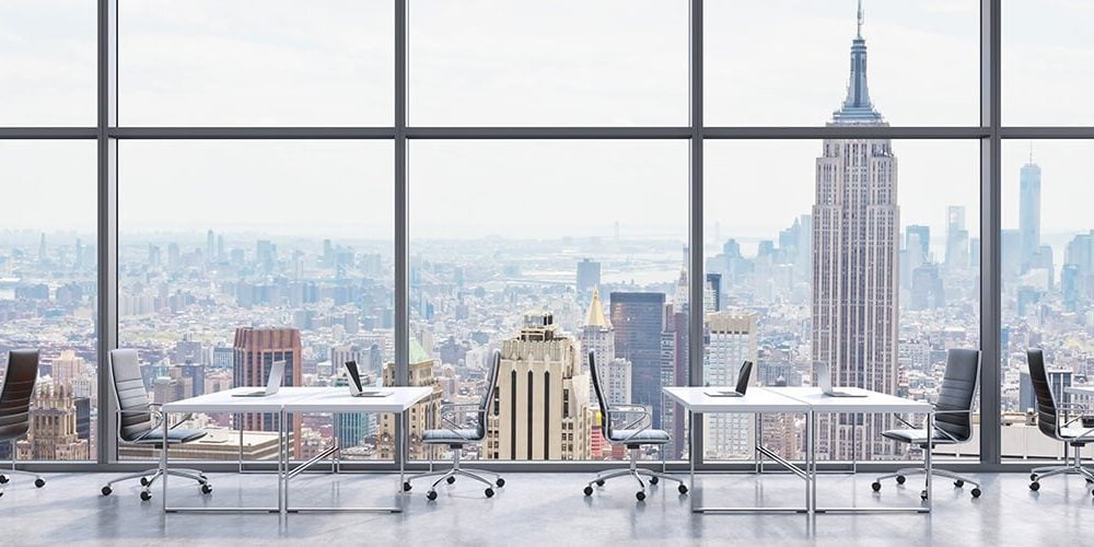 Image of a coworking spot in a high-rise with a view over Lower Manhattan