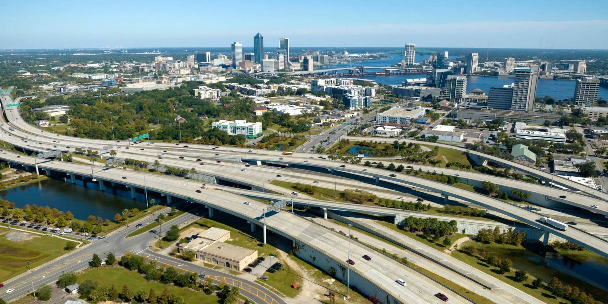 aerial panoramic view of highways heading into jacksonville florida, with the jacksonville skyline in the background