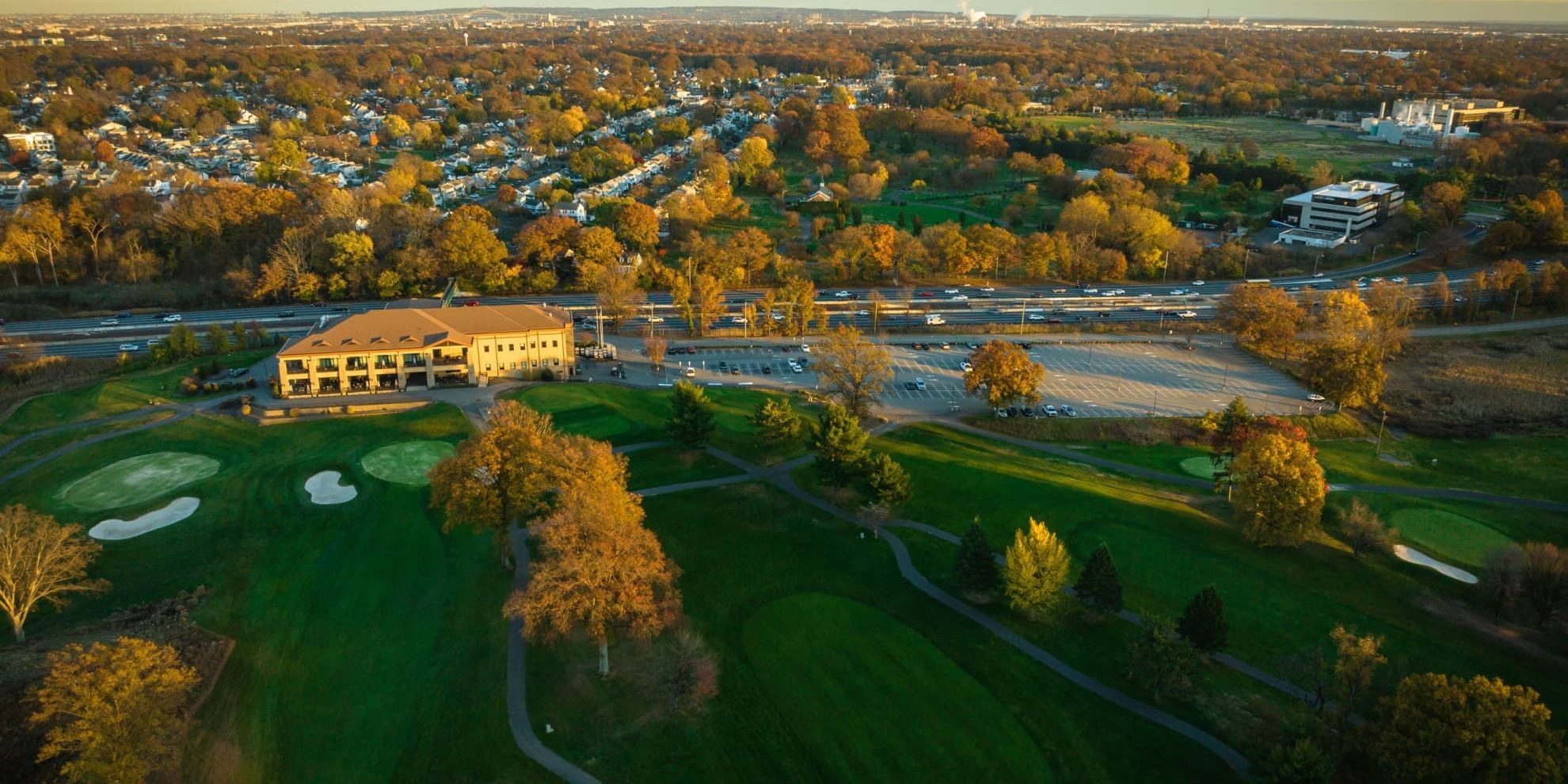 aerial panoramic view of the kenilworth new jersey golf course in the closer plane and the Northeast Science & Technology (NEST) Center (frmerly mercl campus) further back and to the right