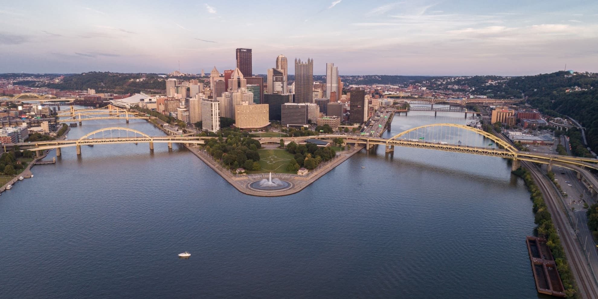 aerial apnoramic view of pittsburgh central business district buildings on island connected by bridges across the river