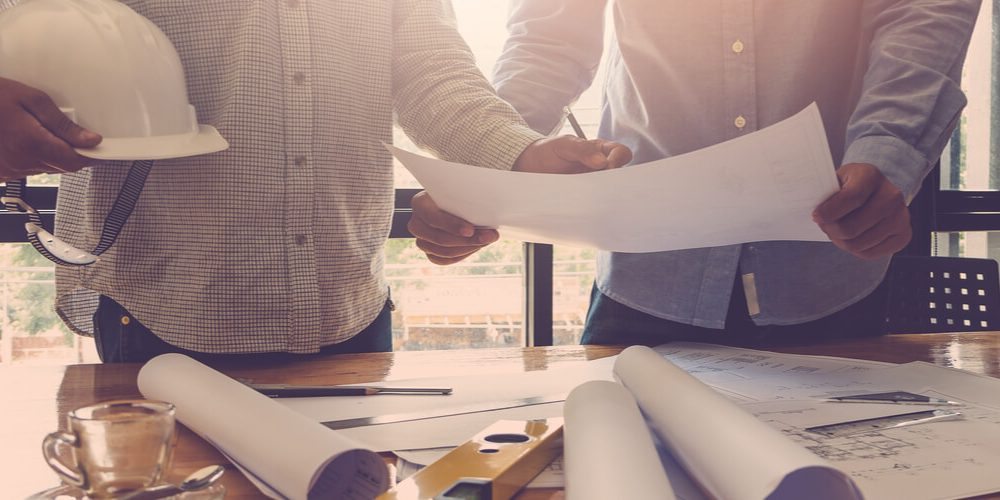 Two architects planning an office building renovation