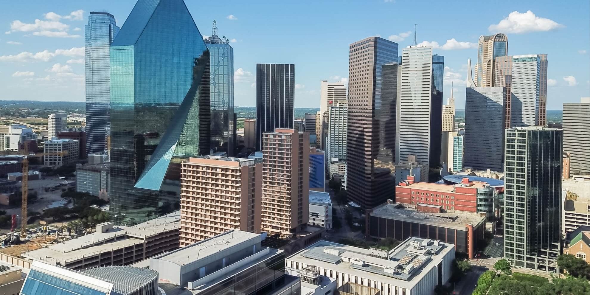 aerial view of uptown dallas office space buildings with facades gleaming in the sunlight