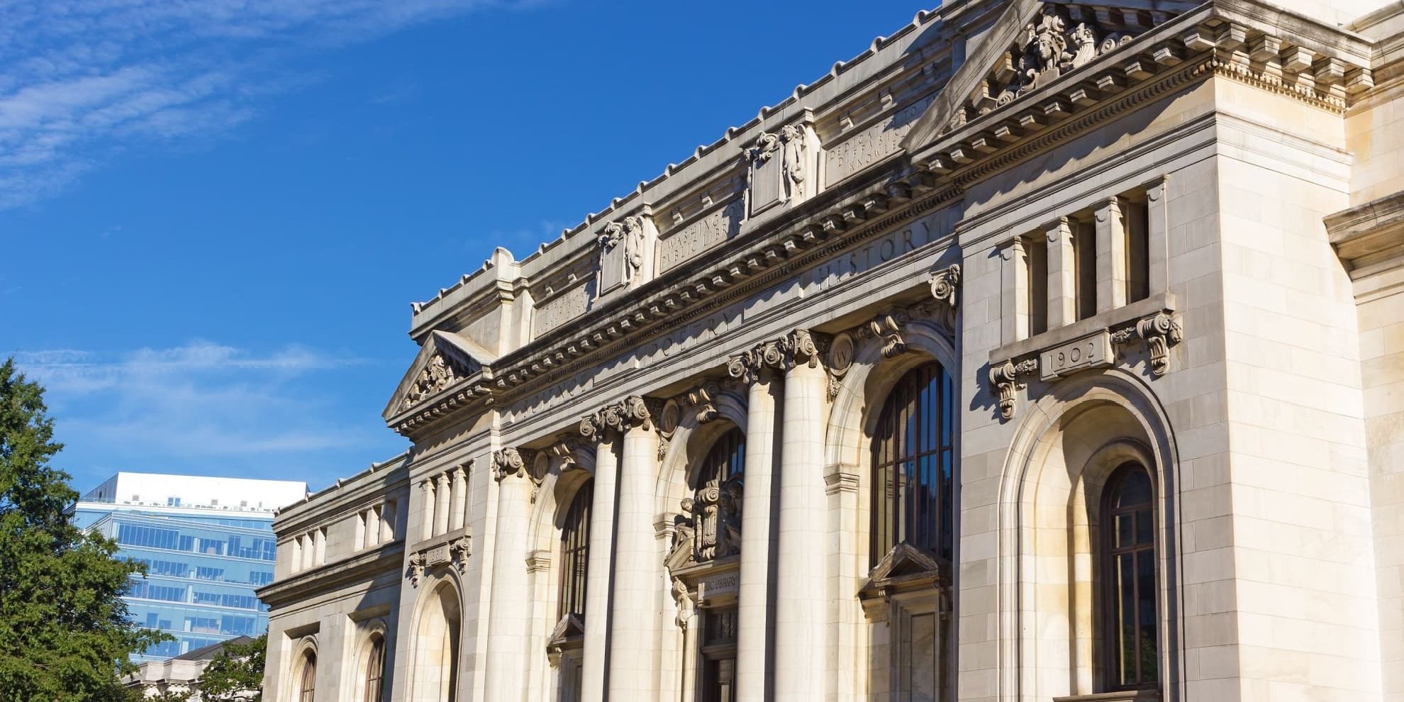 washington dc mt vernon square carnegie library forefront and 901 k street office building background