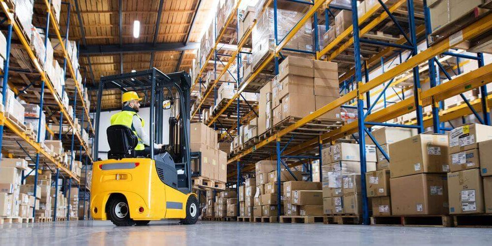 man on forklift in a warehouse