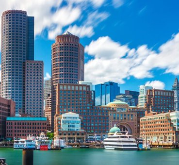 A wide shot of the Boston skyline and waterfront