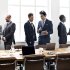 Image of a diverse group of business professionals collaborating at a meeting