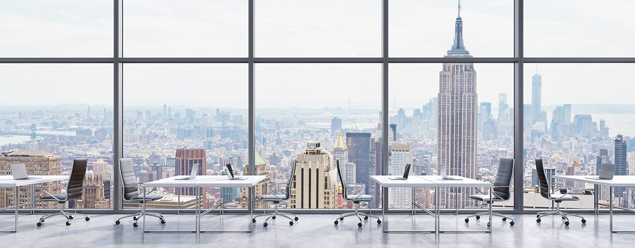 Image of a coworking spot in a high-rise with a view over Lower Manhattan