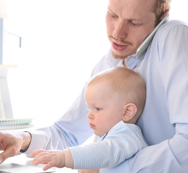 dad and baby in the office