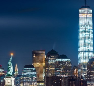 Night view over Lower Manhattan, with One World Trade Center and The Statue of Liberty