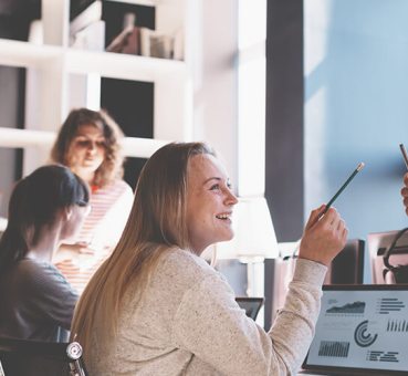 Young business team working together in bright loft space
