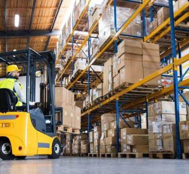 man on forklift in a warehouse